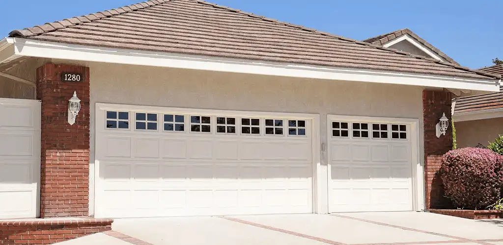 Residential garage door repair service for a double garage door in Arvada, CO