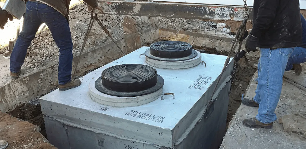 Grease trap installation for a commercial property drainage system in Arvada, CO