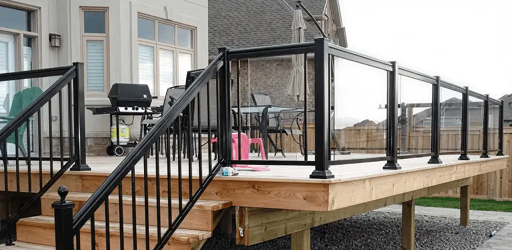 Handrail installation on a deck staircase for safety and code compliance in Arvada, CO